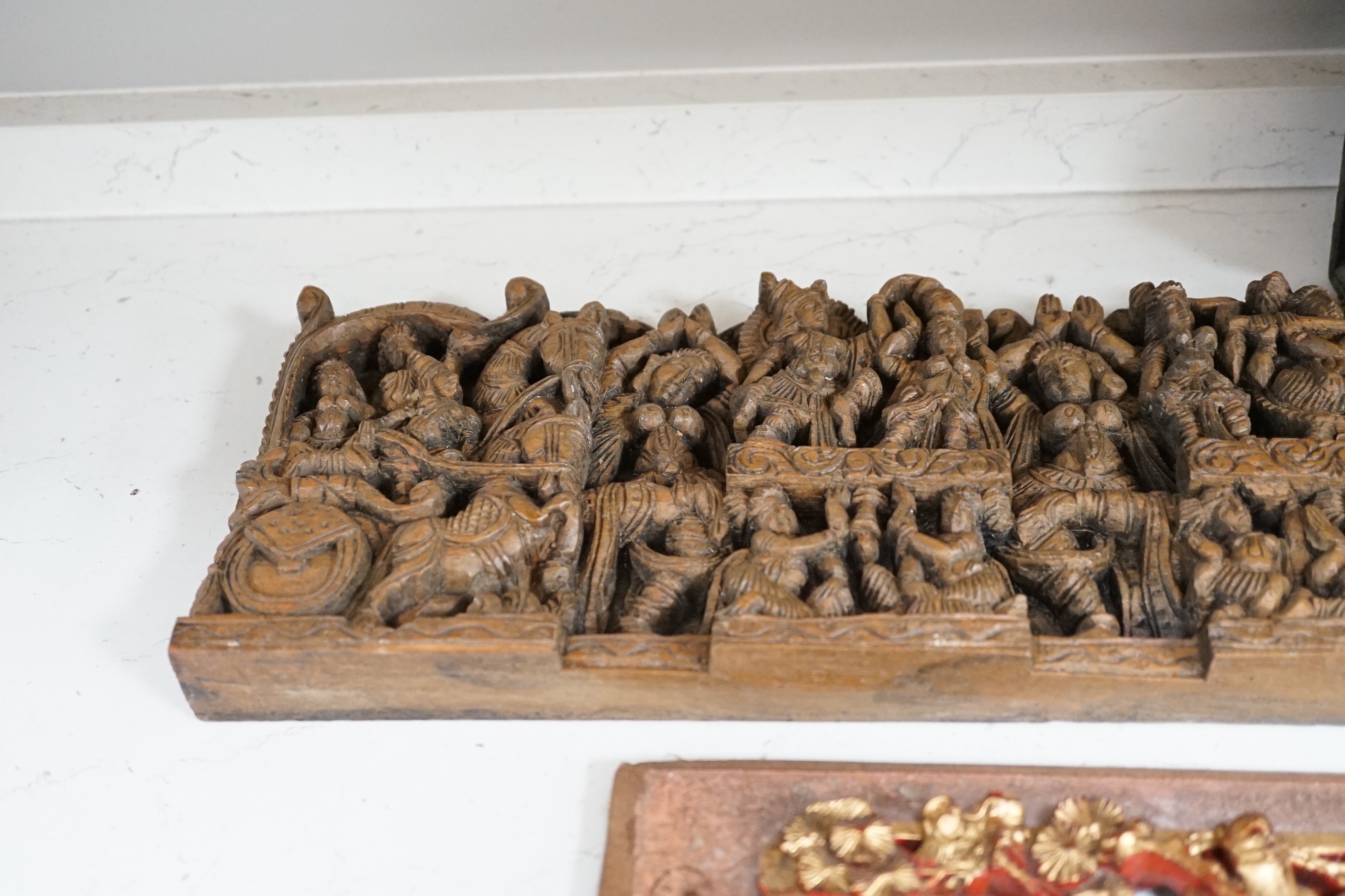 Two South East Asian carved hardwood panels together with three Chinese gilt wood panels (5) largest 6x91cm